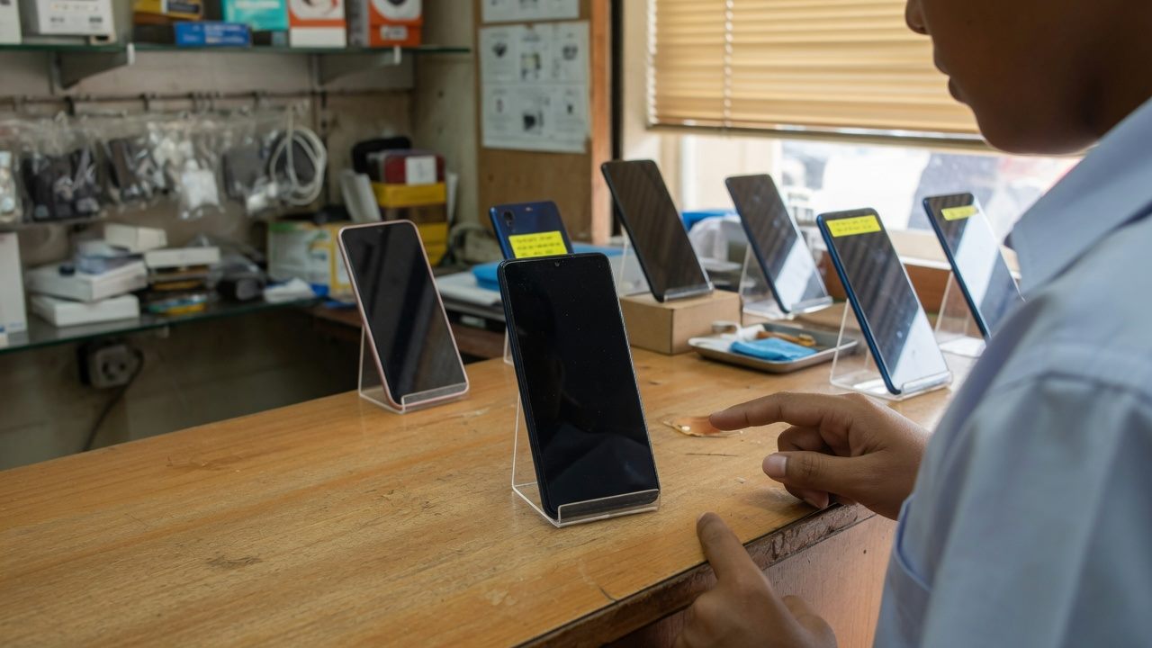 One store phone in front of several other phones